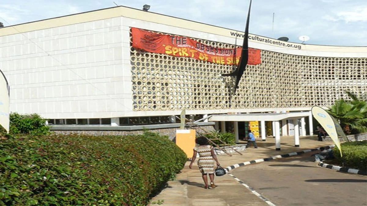 The National Theatre exterior in central Kampala, with its curved patterned facade and main entrance.