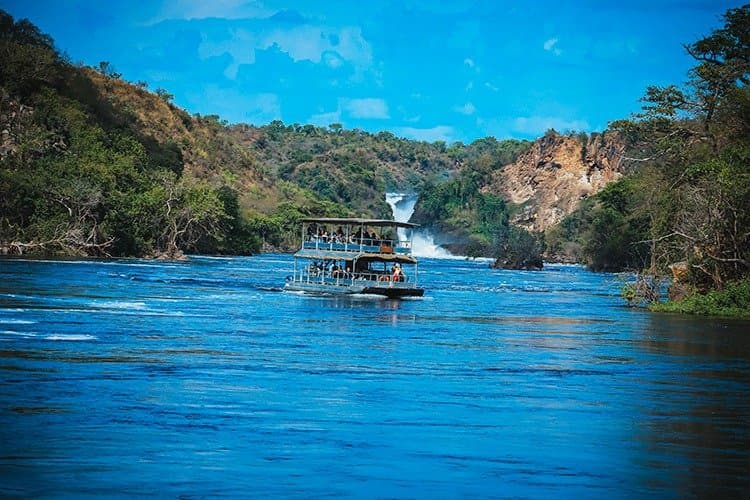 A passenger boat on the Nile approaching Murchison Falls.
