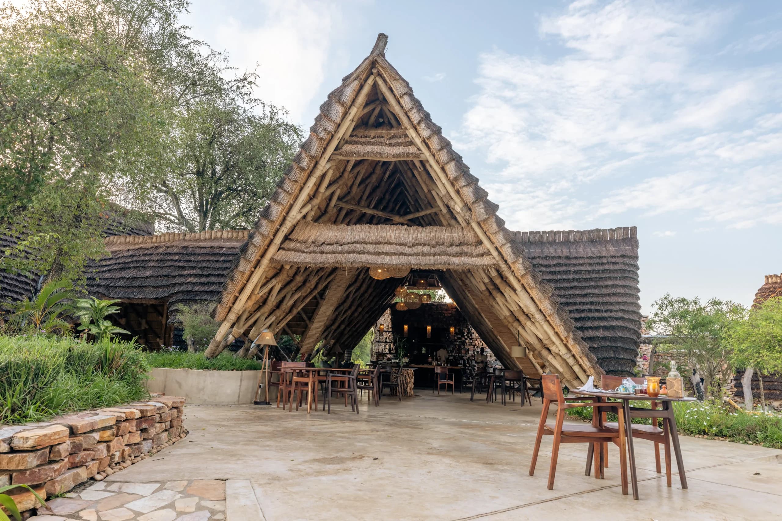 The thatched main building and terrace at Nile Safari Lodge.