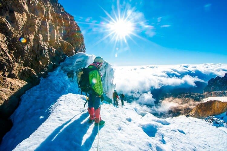 Climbers on a snow-covered Rwenzori summit route