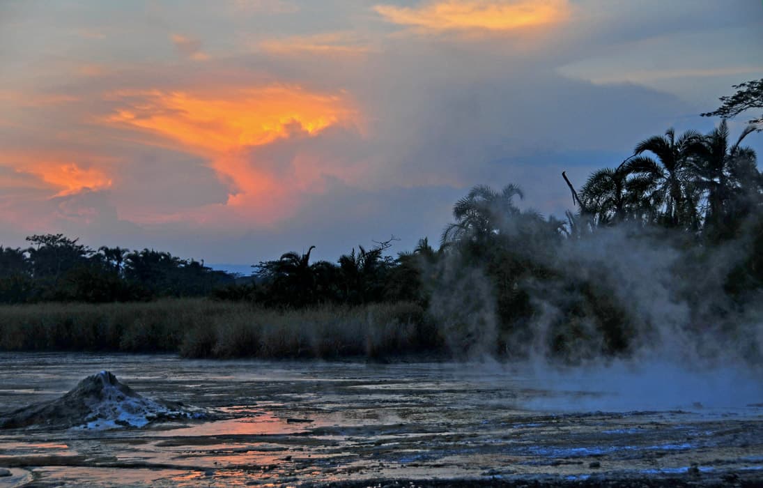 Steam rising from the Sempaya Hot Springs at sunset
